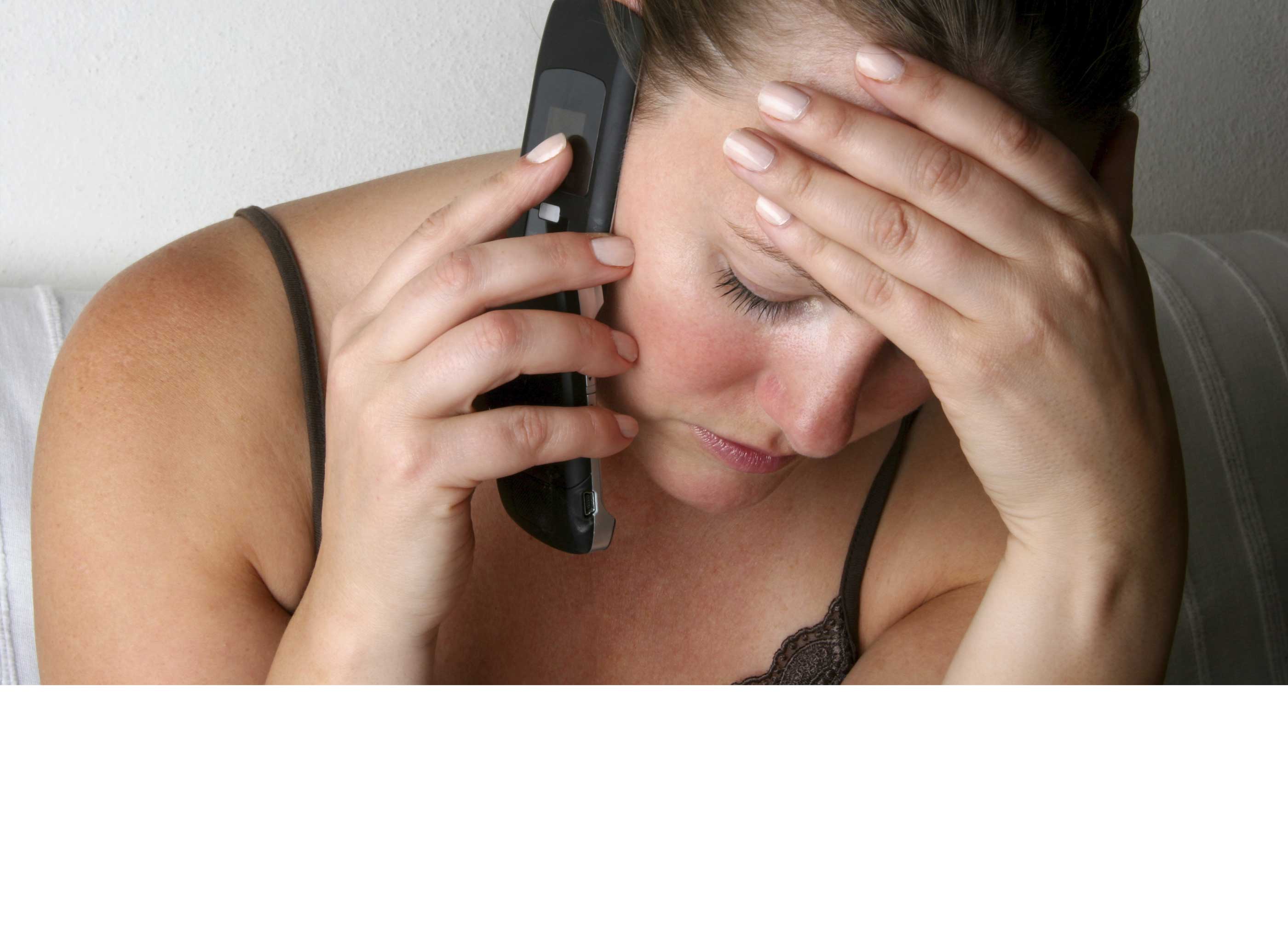 a domestic violence victim speaking on the phone