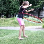a girl using a hula hoop