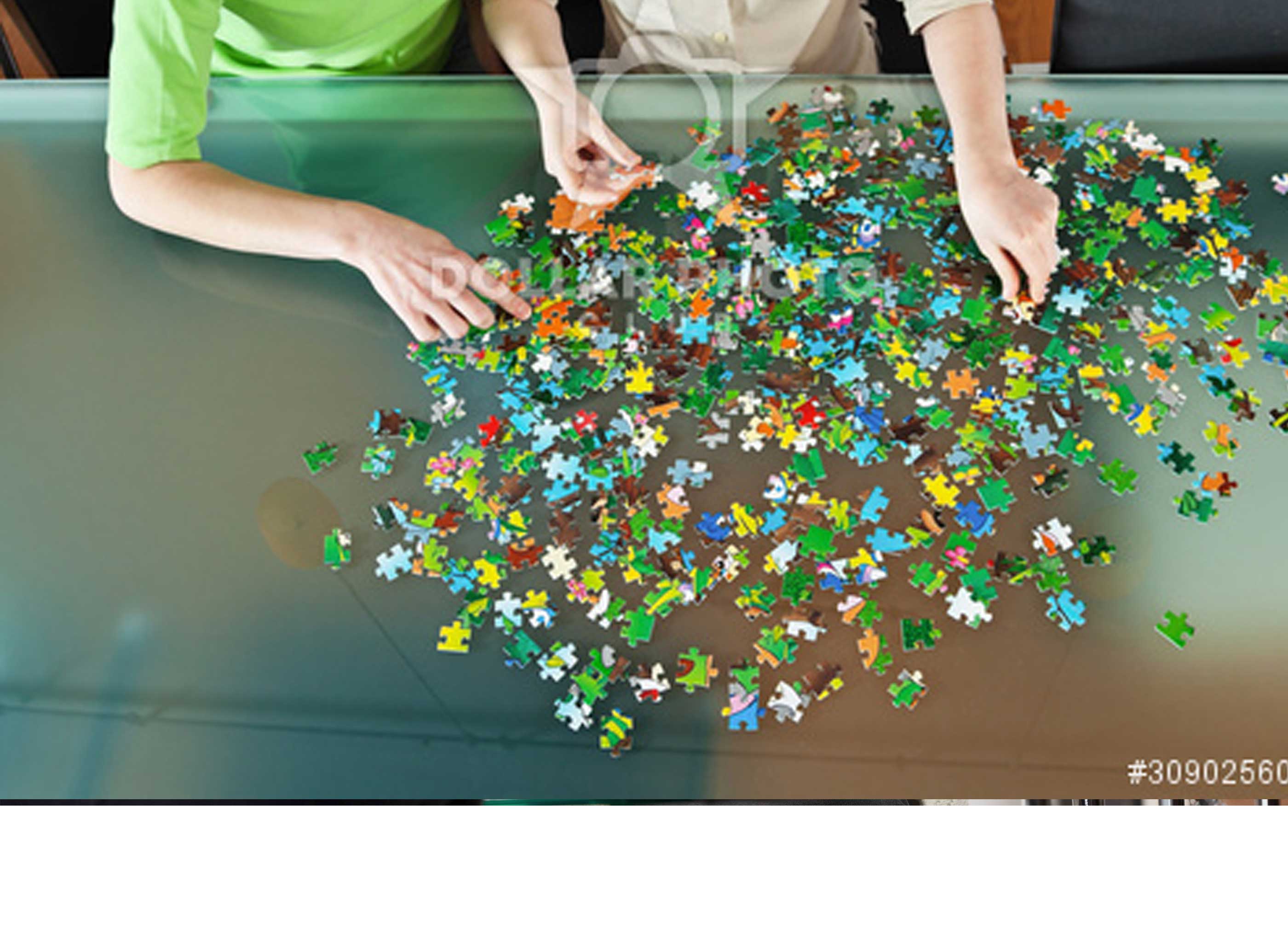 a child putting together a green puzzle