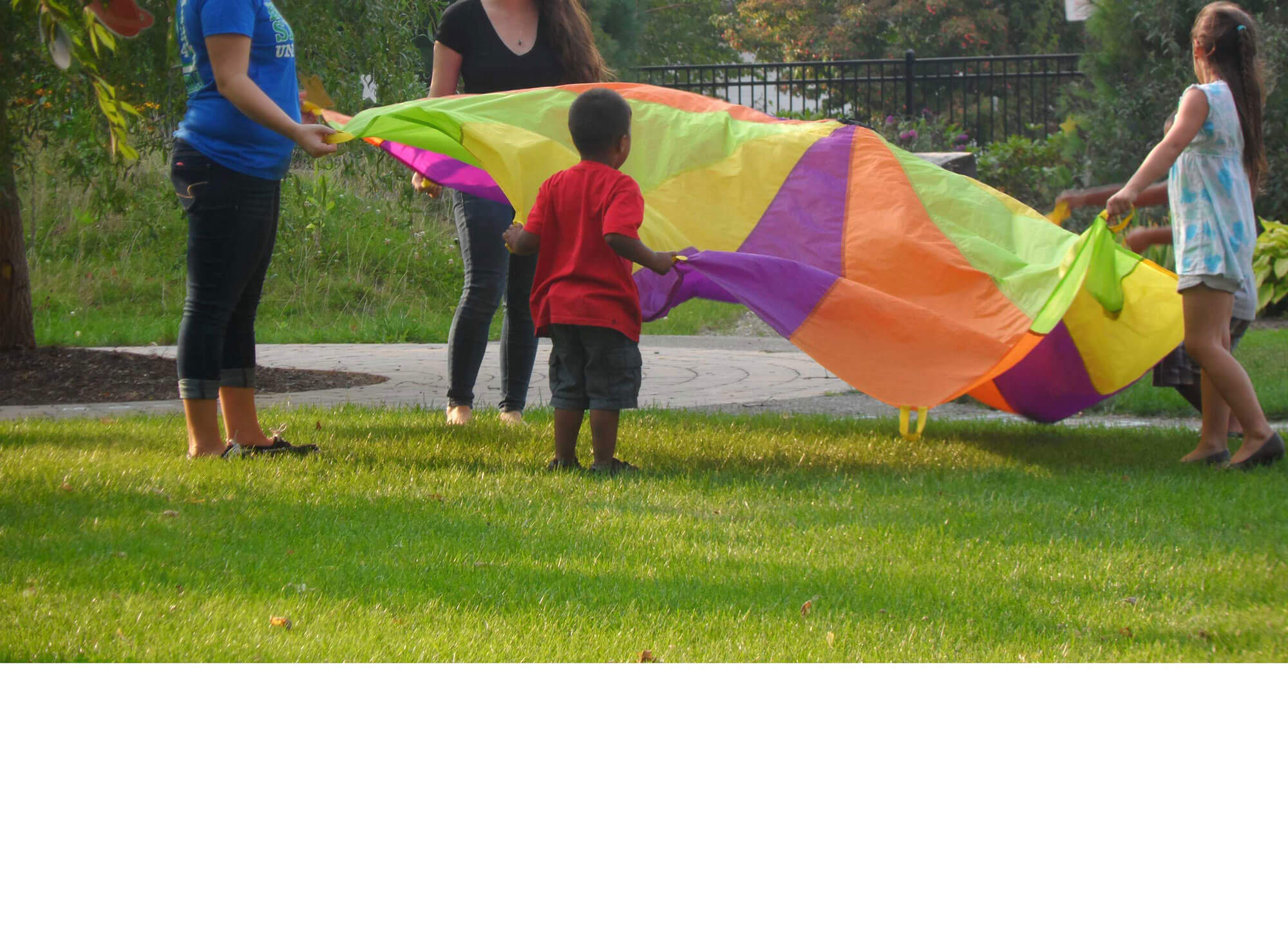 children playing with a parachute